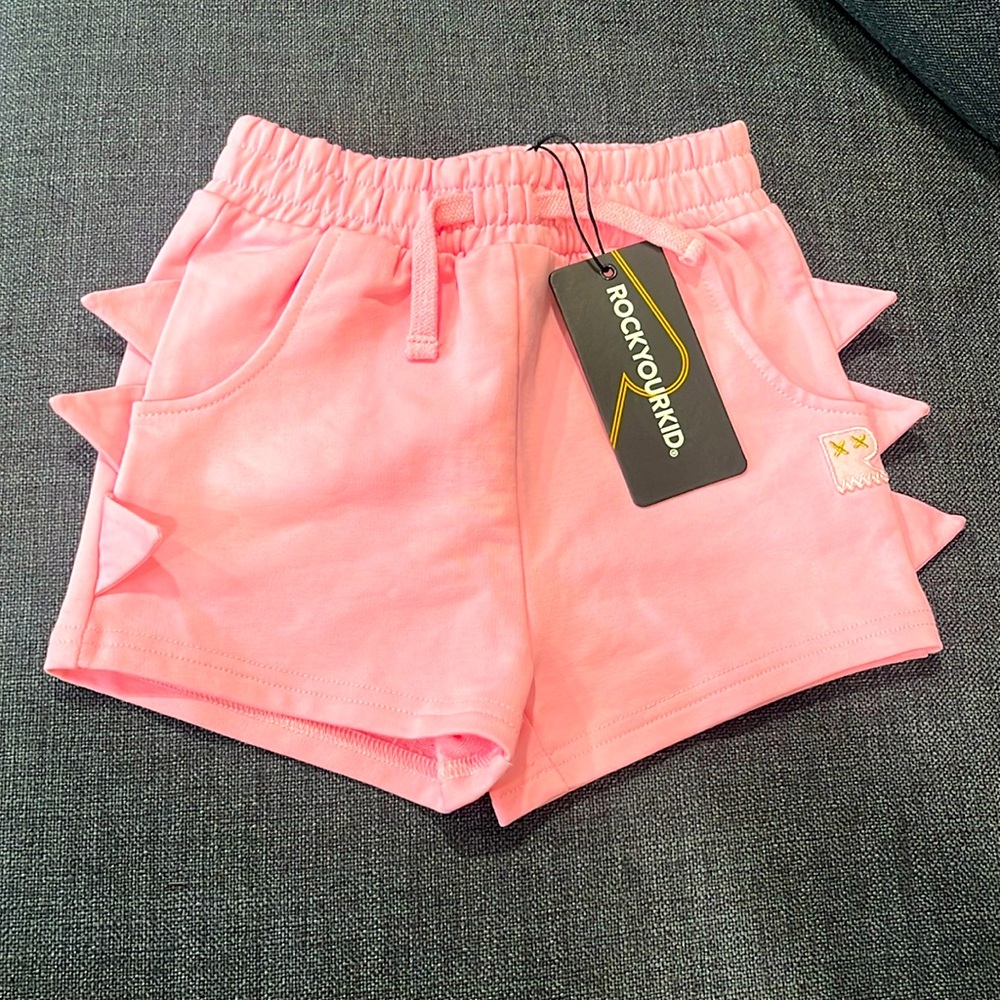 Pink shorts dinosaur side